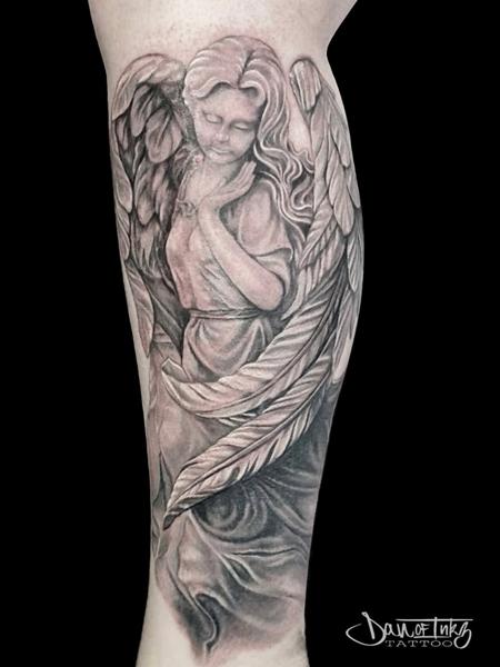 Realism angel statue tattoo by @dan.of.inkz