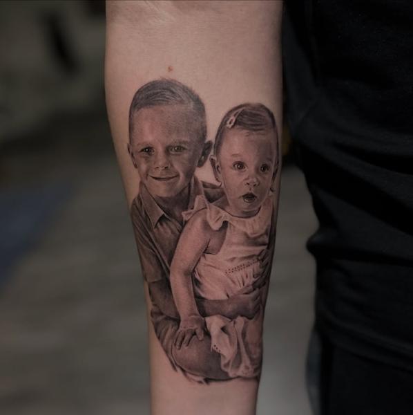 Realism children portrait tattoo by @mrbaldaro