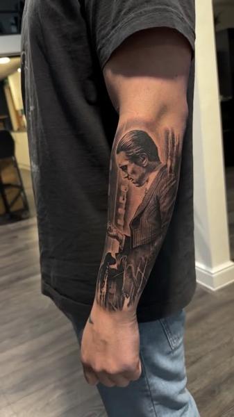 Realism portrait with gun tattoo by @mrbaldaro