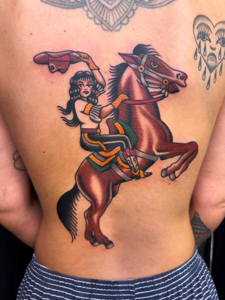 Traditional woman on horse tattoo by @davidhtattoo