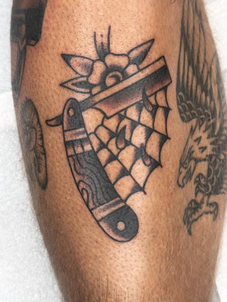 Traditional razor and flower tattoo by @davidhtattoo