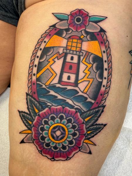 Traditional lighthouse tattoo by @davidhtattoo