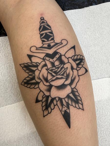 Traditional dagger rose tattoo by @davidhtattoo