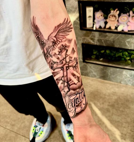 Realism eagle and cross tattoo by @d_chakki