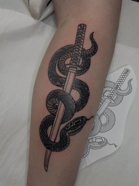 Illustrative blackwork snake katana tattoo by @dexnleettattoo