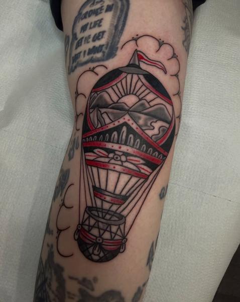 Traditional hot air balloon tattoo by @dexnleettattoo