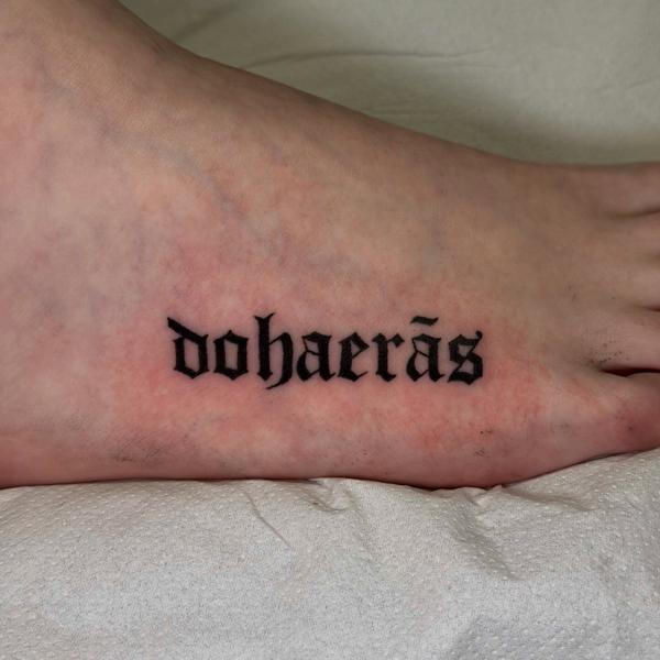 Blackwork gothic text tattoo by @delitetattoo