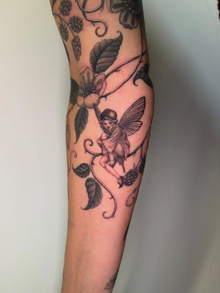 Blackwork fairy and berries tattoo by @delitetattoo