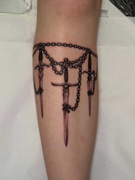 Blackwork swords and chains tattoo by @delitetattoo