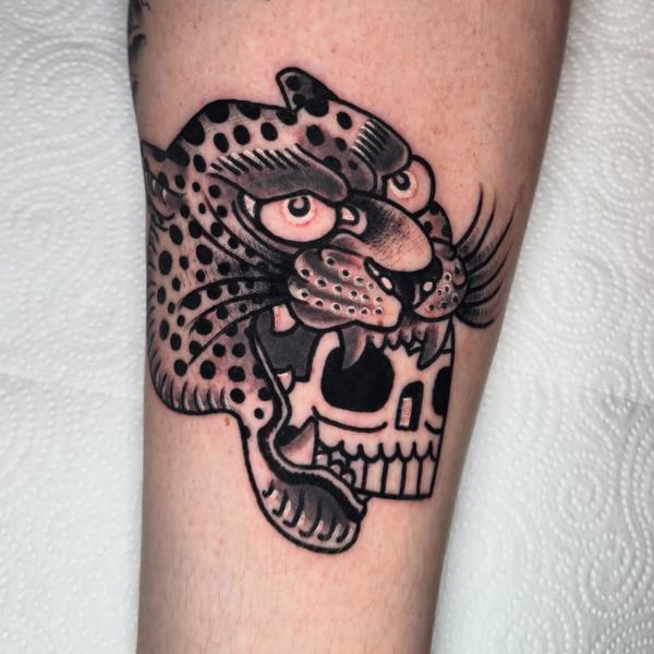 Traditional leopard skull tattoo by @denotattoo