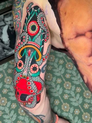 Traditional abstract octopus tattoo by @denotattoo