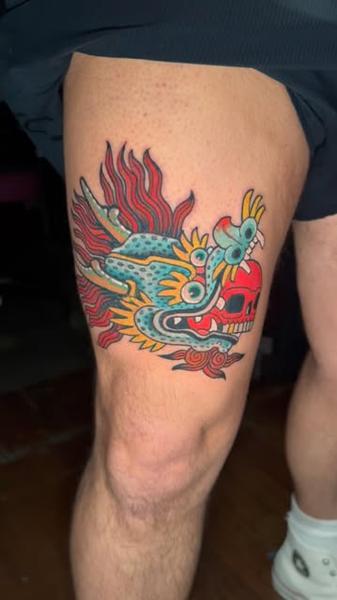 Traditional colorful dragon tattoo by @denotattoo