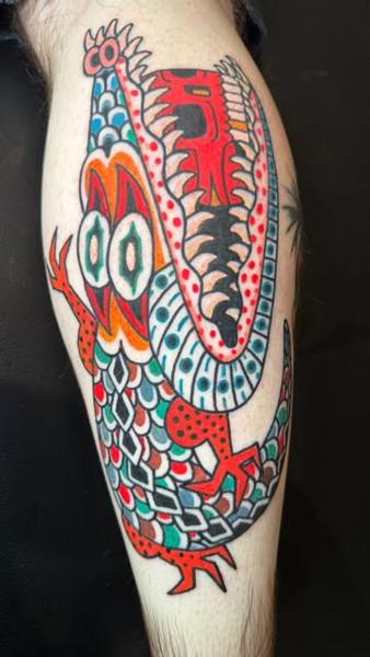 Traditional colorful dragon tattoo by @denotattoo
