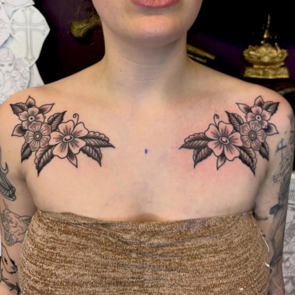 Traditional floral clusters tattoo by @derrythtattoos