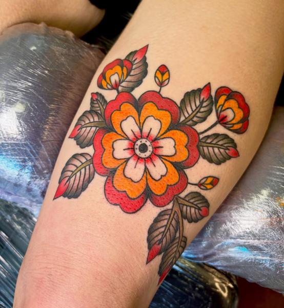 Traditional traditional flower tattoo by @derrythtattoos
