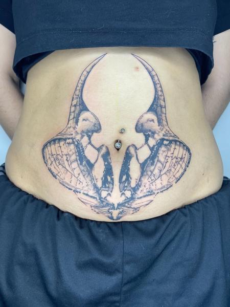 Blackwork horned skulls tattoo by @psari_clown_tattoo