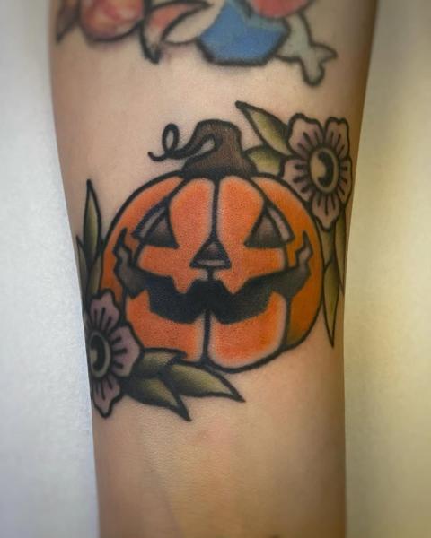 Traditional jack-o'-lantern tattoo by @theblackrabbit_tattoostudio