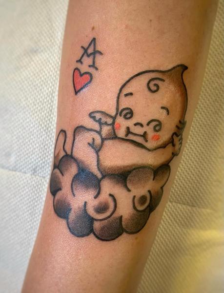 Traditional cherub on cloud tattoo by @theblackrabbit_tattoostudio