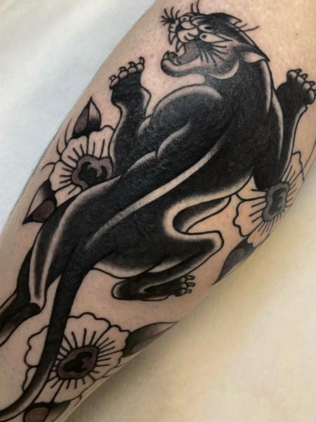 Traditional panther tattoo by @theblackrabbit_tattoostudio