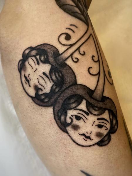 Traditional dual faces tattoo by @theblackrabbit_tattoostudio