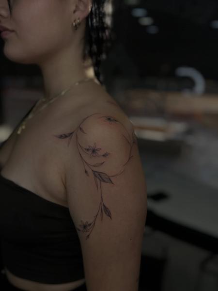 Fine line floral vine tattoo by @dimel_tattooer