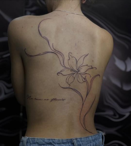 Fine line floral outline tattoo by @dimel_tattooer