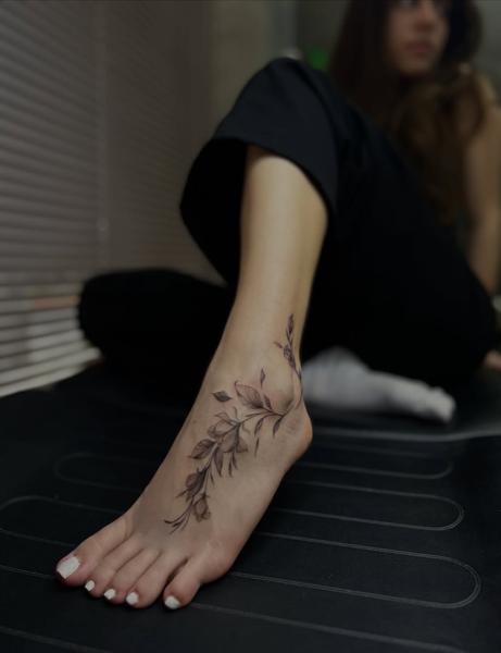 Fine line botanical floral branch tattoo by @dimel_tattooer