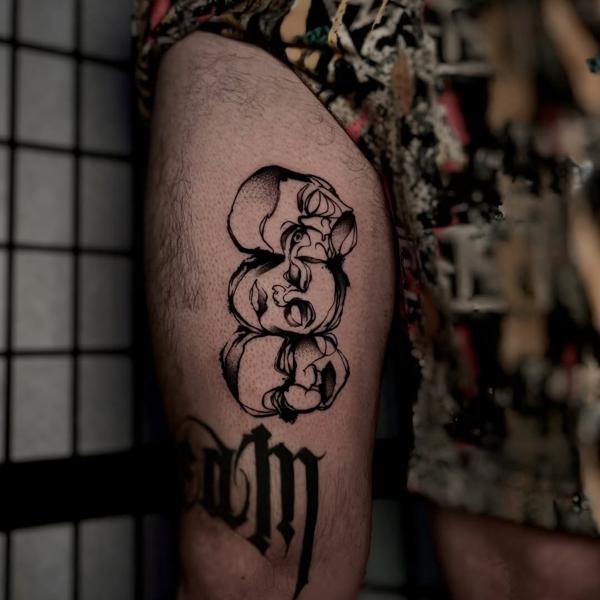 Blackwork stacked abstract faces tattoo by @bdt_tattoos