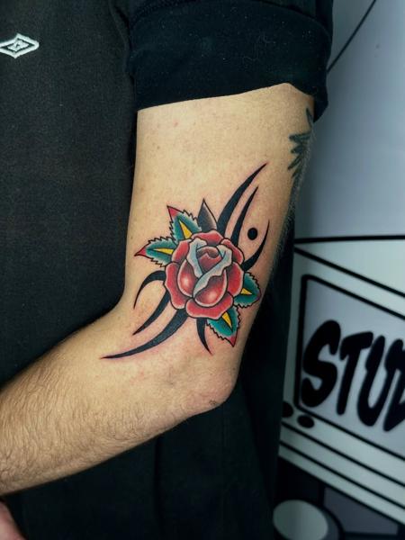 Traditional tribal rose tattoo by @fitz.ttt