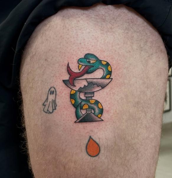 Traditional snake and dagger tattoo by @fitz.ttt