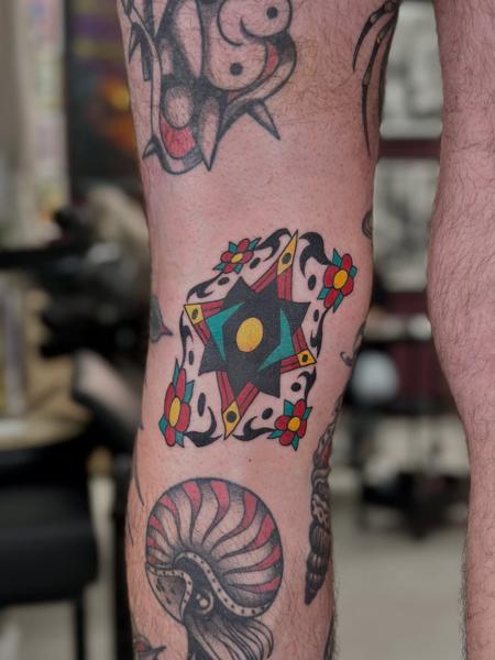 Traditional geometric star tattoo by @fitz.ttt