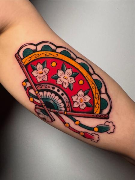 Traditional floral fan tattoo by @dimitris_v_tattooer