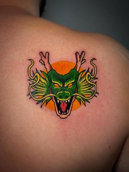 Traditional dragon head tattoo by @dimos_thrash_tattoo