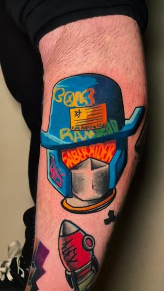 New school graffiti helmet tattoo by @dimos_thrash_tattoo