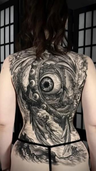 Realism mechanical eye tattoo by @dinos.mts