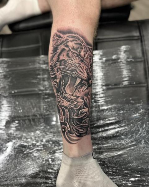 Realism tiger head tattoo by @divineeyetattoo