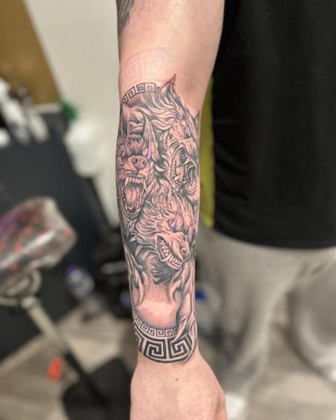 Blackwork cerberus tattoo by @divineeyetattoo