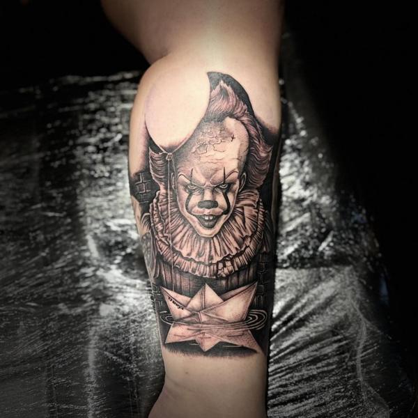 Realism creepy clown tattoo by @divineeyetattoo