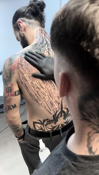 Abstract abstract back piece tattoo by @domi_n_ink_