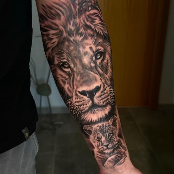 Realism lion and cub tattoo by @domi_n_ink_