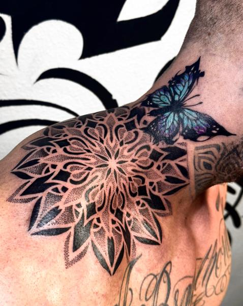 Ornamental mandala butterfly tattoo by @domi_n_ink_