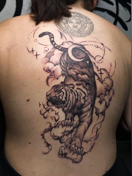 Blackwork tiger in clouds tattoo by @domi_n_ink_