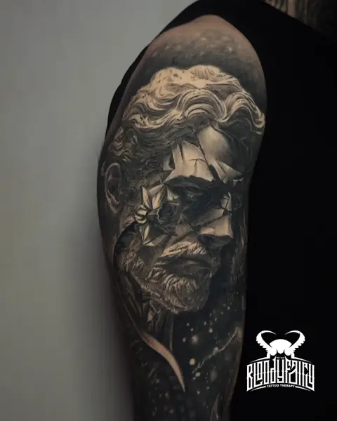 Realism fragmented statue tattoo by @dostattoo_marios