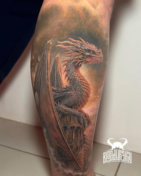Realism dragon on tower tattoo by @dostattoo_marios