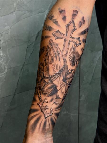Realism praying hands tattoo by @_drag.tats