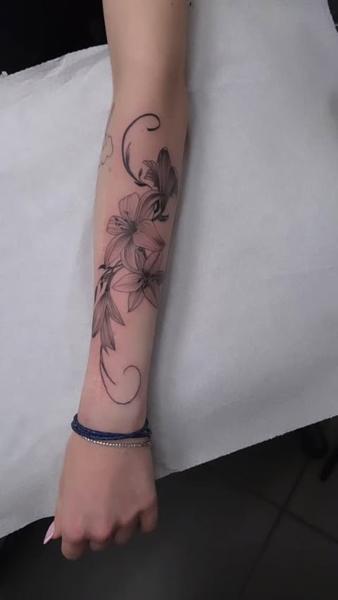 Fine line floral design tattoo by @dreamtattooathens