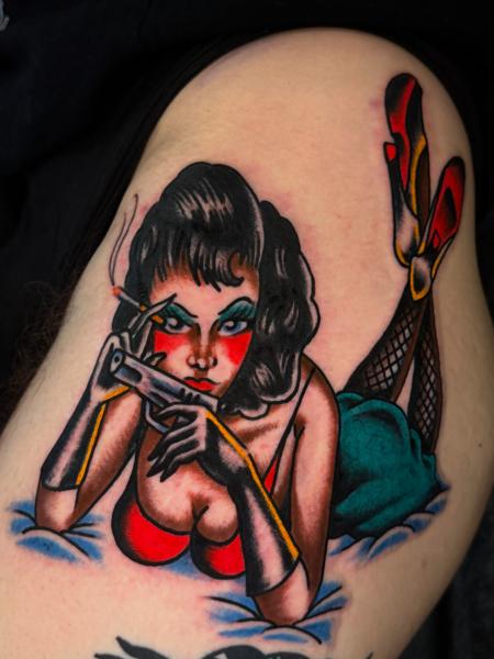 Traditional pin-up girl tattoo by @dretattoo
