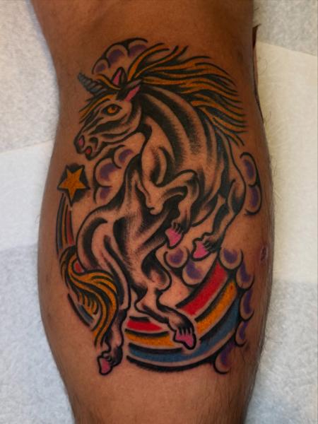 Traditional unicorn tattoo by @dretattoo