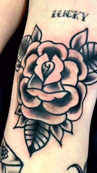 Traditional traditional rose tattoo by @edstaplestattooer