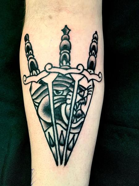 Traditional dagger panther tattoo by @edstaplestattooer